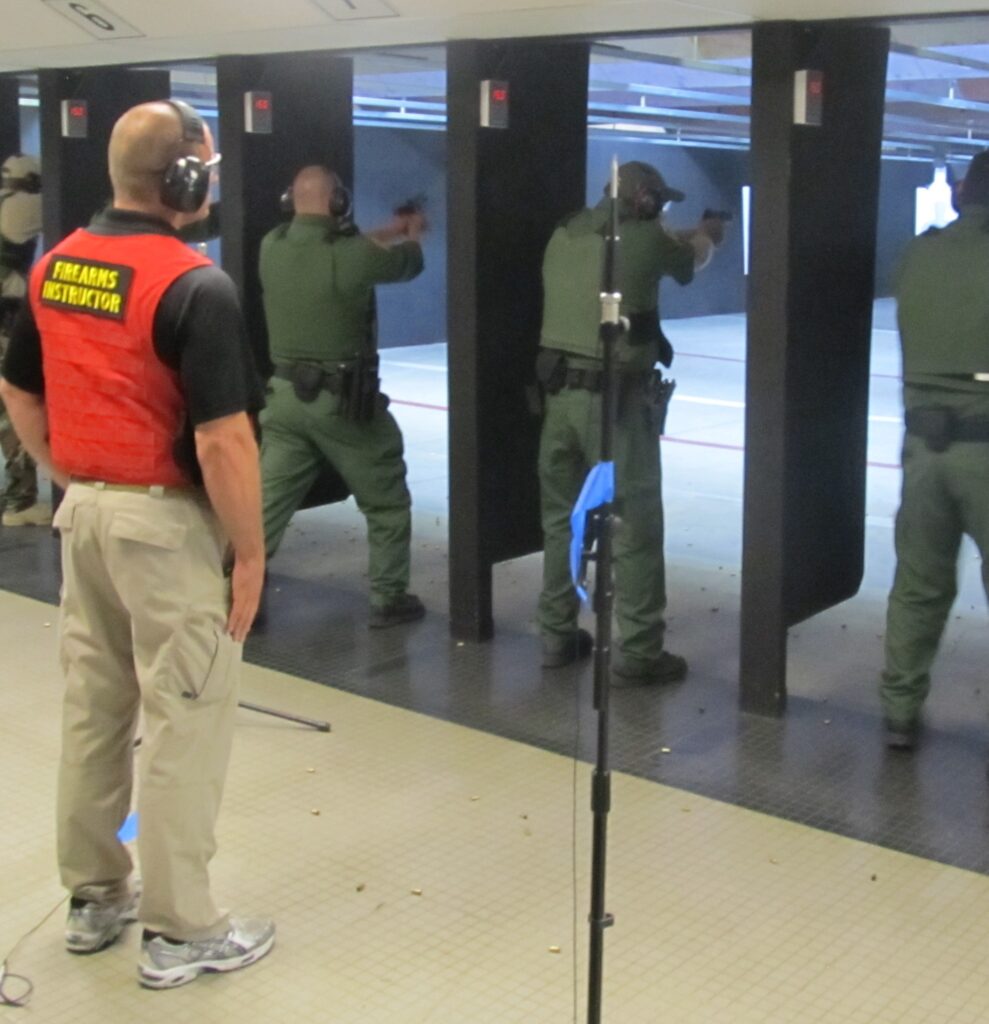 Federal_law_enforcement_officers_during_firearms_training_exercises_at_indoor_firing_range (3
